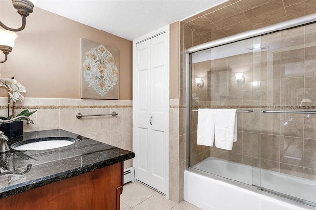 200 Hoffman Ave Unit 405, Cranston, RI 02920 - full bathroom featuring tile walls, a baseboard radiator, combined bath / shower with glass door, tile patterned floors, and vanity