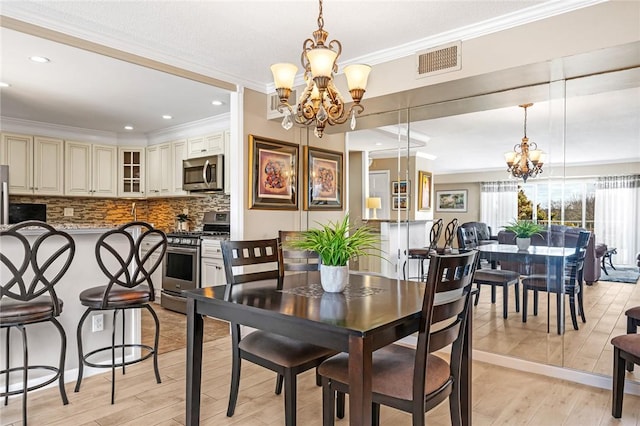 200 Hoffman Ave Unit 405, Cranston, RI 02920 - dining space with a chandelier, crown molding, light wood-style flooring, and recessed lighting