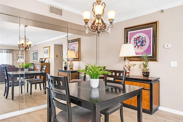 200 Hoffman Ave Unit 405, Cranston, RI 02920 - dining space with a chandelier, crown molding, light wood-style floors, and baseboards