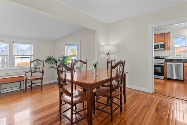 23 Smith Ave Unit 2, Newport, RI 02840 - dining room featuring baseboards, light wood finished floors, and lofted ceiling