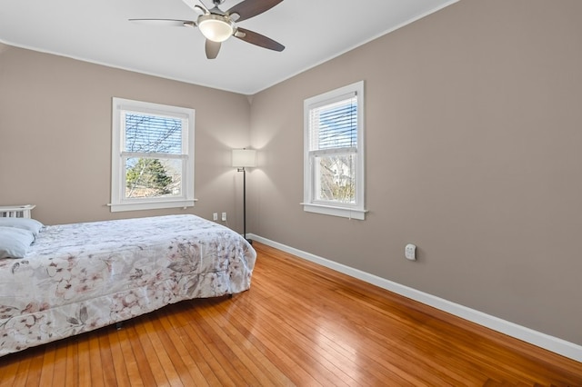 23 Smith Ave Unit 2, Newport, RI 02840 - bedroom with light wood-style floors, baseboards, crown molding, and ceiling fan