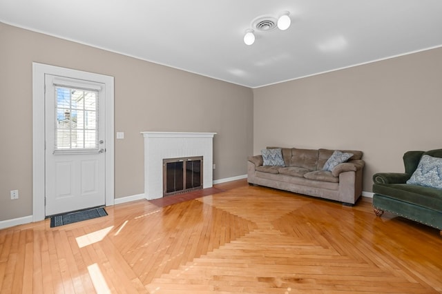 23 Smith Ave Unit 2, Newport, RI 02840 - living area featuring a brick fireplace, baseboards, and visible vents