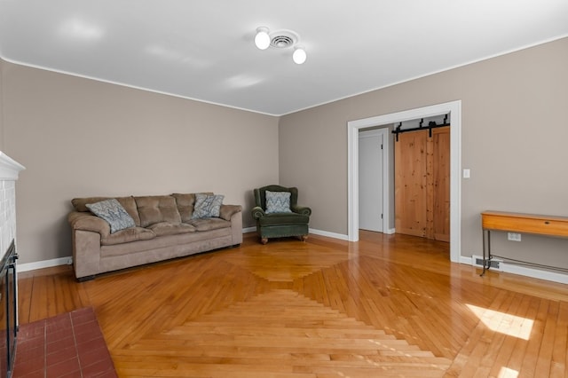23 Smith Ave Unit 2, Newport, RI 02840 - living room with baseboards, a barn door, crown molding, and visible vents