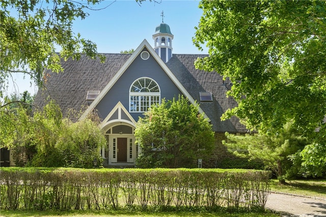 view of front of home featuring a shingled roof