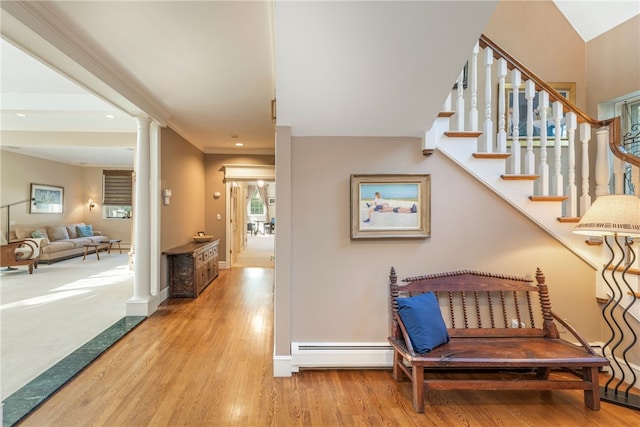 hall with a baseboard heating unit, recessed lighting, decorative columns, baseboards, and wood finished floors