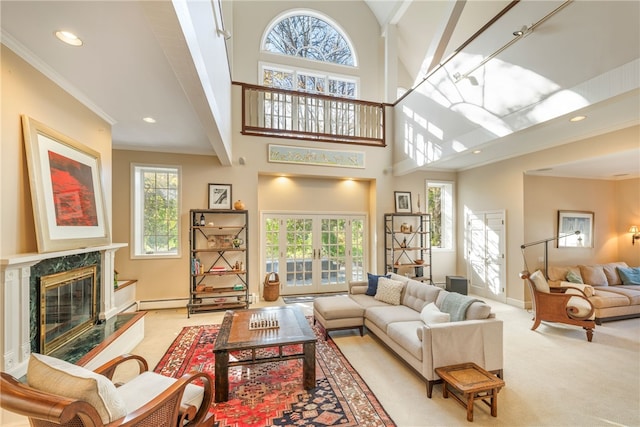 living room featuring a towering ceiling, a wealth of natural light, crown molding, and carpet floors