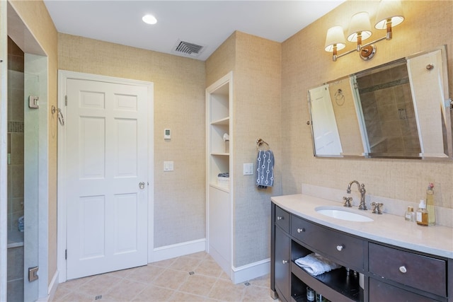 full bath with vanity, visible vents, tile patterned floors, and a shower stall