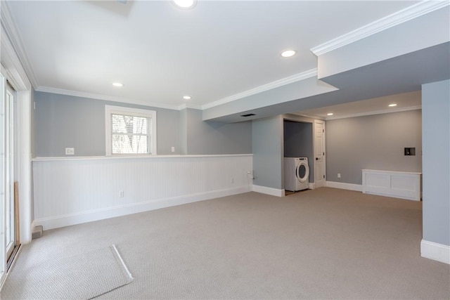 below grade area with crown molding, light carpet, recessed lighting, and washer / clothes dryer