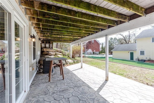 view of patio featuring fence and central AC unit