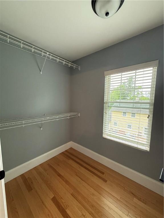 spacious closet with light wood-style flooring