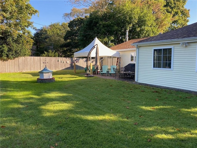 view of yard with fence and a patio area