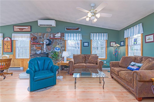 living room with a wall mounted air conditioner, a baseboard radiator, wood finished floors, a ceiling fan, and lofted ceiling