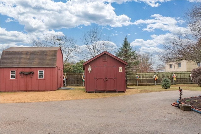view of shed with fence