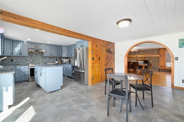 135 Eagleville Rd, Tiverton, RI 02878 - dining space with arched walkways and wooden walls