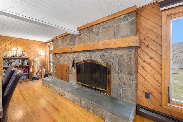 135 Eagleville Rd, Tiverton, RI 02878 - living room featuring baseboard heating, wood walls, wood finished floors, a fireplace, and wood ceiling with exposed beams
