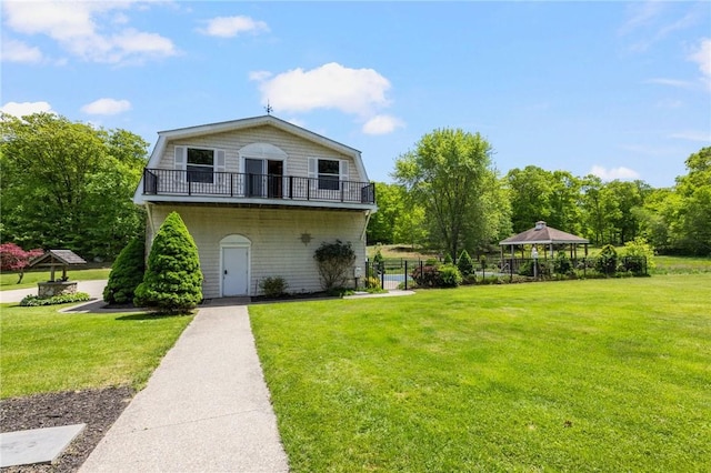 135 Eagleville Rd, Tiverton, RI 02878 - view of home's exterior featuring a yard, a gazebo, a gambrel roof, and a balcony