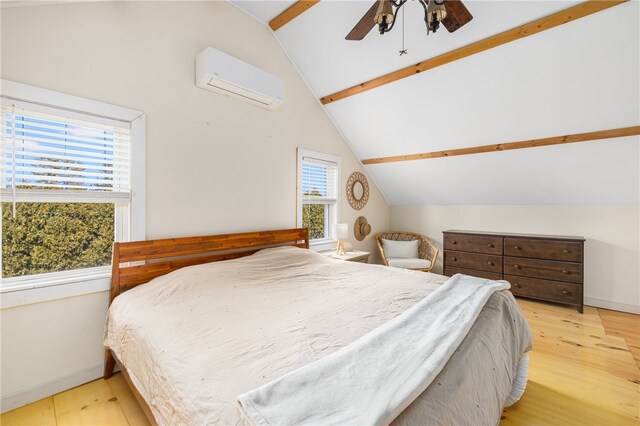 4588 Main Rd, Tiverton, RI 02878 - bedroom with vaulted ceiling with beams, a wall mounted AC, wood finished floors, and baseboards