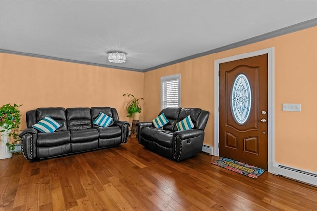 living room featuring ornamental molding, a baseboard heating unit, and hardwood / wood-style flooring