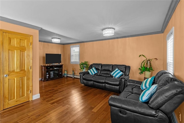 living area featuring hardwood / wood-style floors, baseboards, crown molding, and baseboard heating