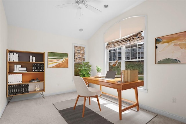 carpeted office with baseboards, lofted ceiling, and ceiling fan