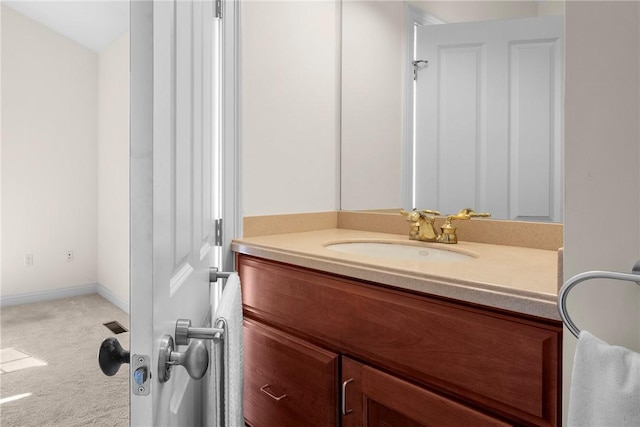 bathroom featuring vanity and baseboards