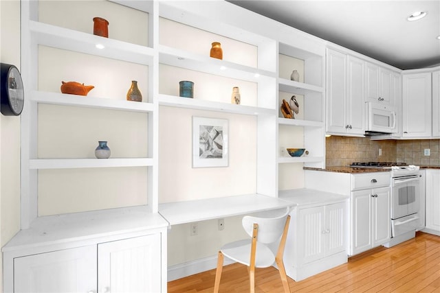 kitchen with white cabinetry, open shelves, white appliances, decorative backsplash, and light wood finished floors