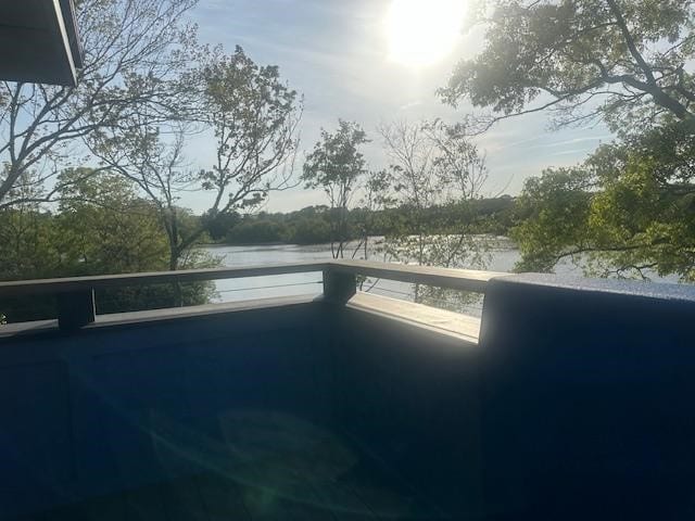 balcony featuring a water view