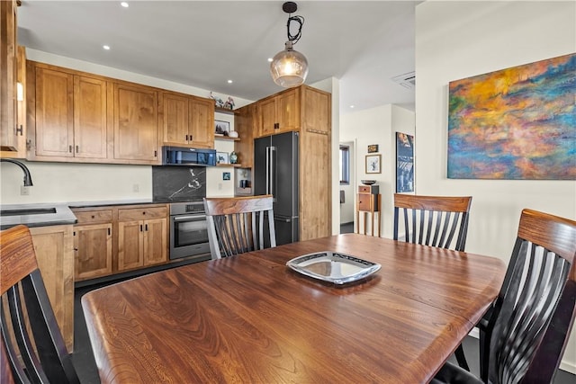 dining room featuring recessed lighting