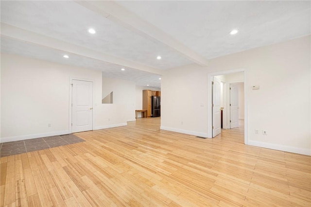 982 Plainfield St Unit 4, Johnston, RI 02919 - unfurnished living room with light wood-type flooring, beam ceiling, recessed lighting, and baseboards