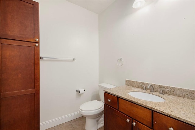 982 Plainfield St Unit 4, Johnston, RI 02919 - bathroom with tile patterned flooring, toilet, vanity, and baseboards