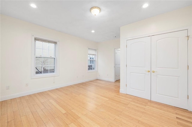 982 Plainfield St Unit 4, Johnston, RI 02919 - unfurnished bedroom with light wood finished floors, baseboards, recessed lighting, and a closet