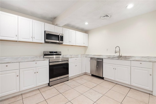 982 Plainfield St Unit 4, Johnston, RI 02919 - kitchen featuring stainless steel appliances, a sink, white cabinetry, beamed ceiling, and recessed lighting