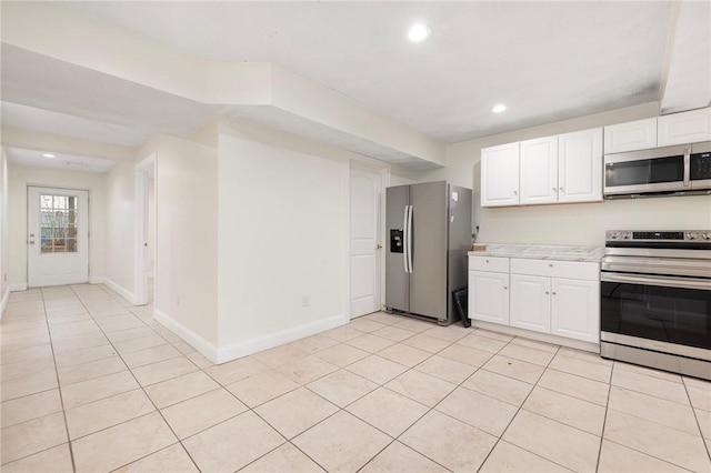 982 Plainfield St Unit 4, Johnston, RI 02919 - kitchen featuring stainless steel appliances, light tile patterned flooring, white cabinetry, light countertops, and recessed lighting