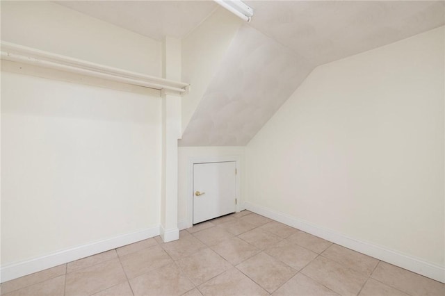 982 Plainfield St Unit 4, Johnston, RI 02919 - bonus room with lofted ceiling, baseboards, and light tile patterned floors