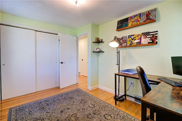 office featuring baseboards and wood finished floors
