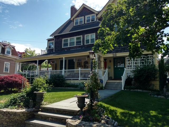 55 Hunter Ave, Newport, RI 02840 - view of front of property featuring a front lawn, a chimney, and covered porch