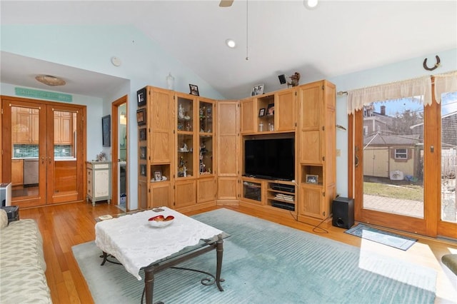 55 Hunter Ave, Newport, RI 02840 - living area with lofted ceiling, french doors, and light wood-style floors