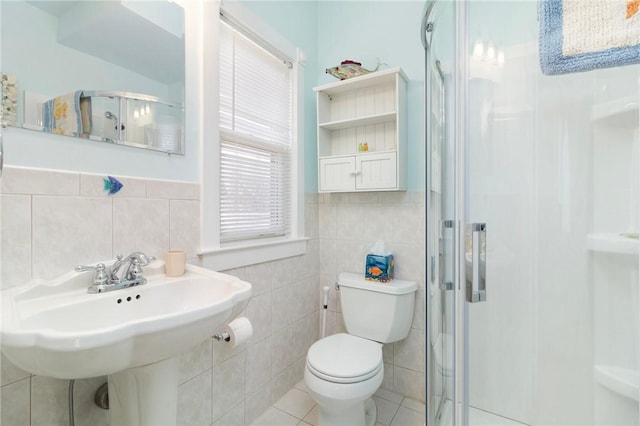 55 Hunter Ave, Newport, RI 02840 - bathroom with a stall shower, toilet, tile patterned flooring, and tile walls