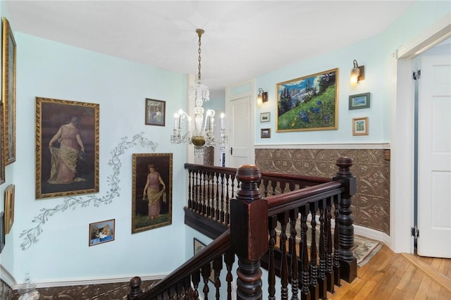 55 Hunter Ave, Newport, RI 02840 - stairway featuring wood finished floors and an inviting chandelier