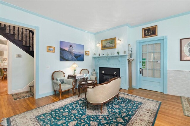 55 Hunter Ave, Newport, RI 02840 - sitting room featuring wood finished floors, a tile fireplace, and stairway