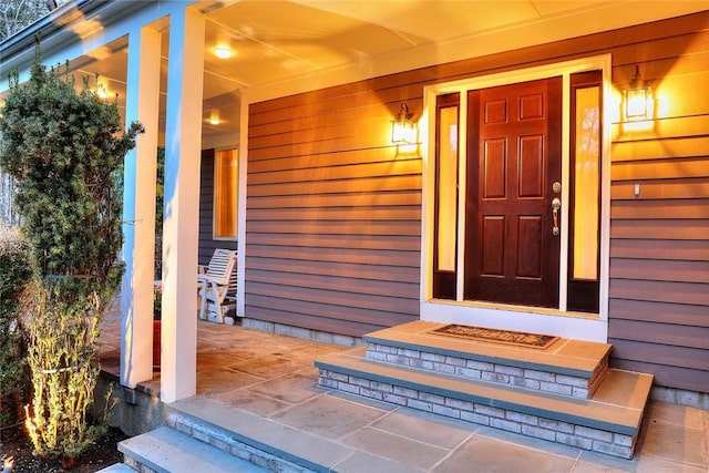 property entrance featuring a porch
