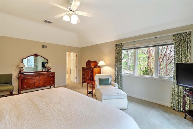 carpeted bedroom featuring baseboards, visible vents, ceiling fan, and vaulted ceiling