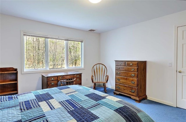 carpeted bedroom featuring visible vents and baseboards