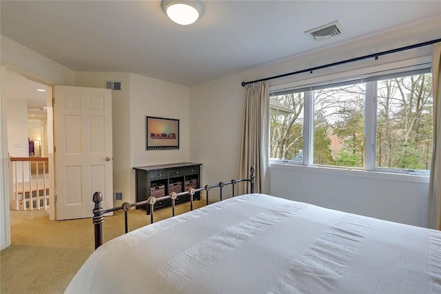 bedroom featuring visible vents and carpet