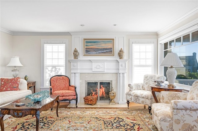 7 Fenway Rd, Westerly, RI 02891 - living area featuring crown molding, a fireplace with flush hearth, wood finished floors, and a healthy amount of sunlight