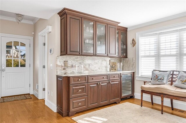 7 Fenway Rd, Westerly, RI 02891 - bar featuring tasteful backsplash, plenty of natural light, crown molding, and bar area