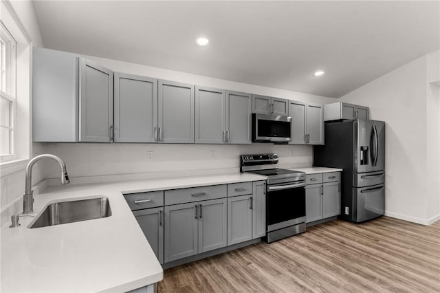 5 Cottage St, Westerly, RI 02891 - kitchen with gray cabinets, appliances with stainless steel finishes, light wood finished floors, and a sink