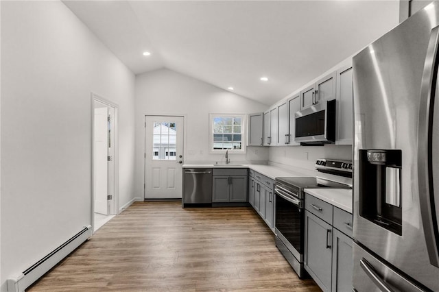 5 Cottage St, Westerly, RI 02891 - kitchen with a sink, light countertops, baseboard heating, gray cabinetry, and stainless steel appliances