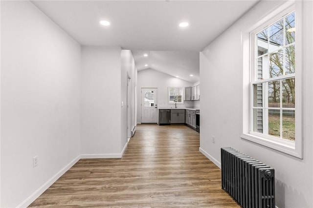 5 Cottage St, Westerly, RI 02891 - hallway featuring a wealth of natural light, baseboards, radiator, and wood finished floors