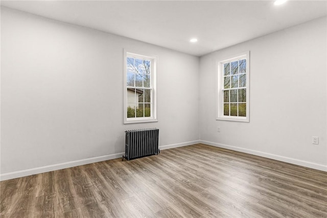 5 Cottage St, Westerly, RI 02891 - spare room with radiator, wood finished floors, baseboards, and recessed lighting